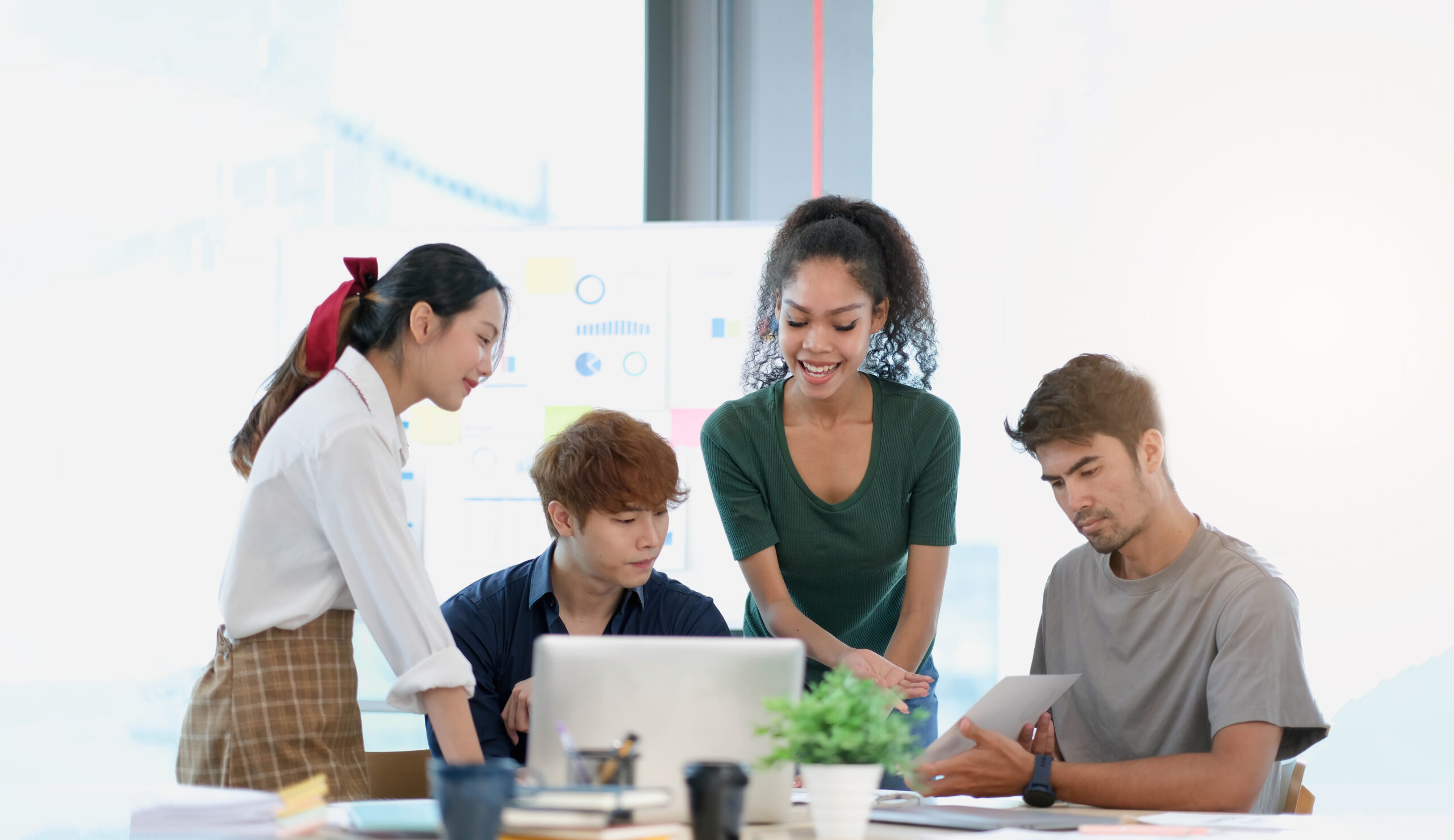 Group of young asian business people in smart casual wear workin